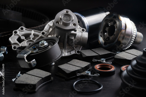 Auto parts spare parts car on black background. Auto parts store. Suspension and engine parts.