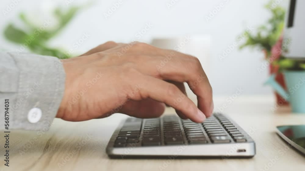 view side Closeup business people hands typing on keyboard computer desktop view side Closeup business people hands typing on keyboard computer desktop