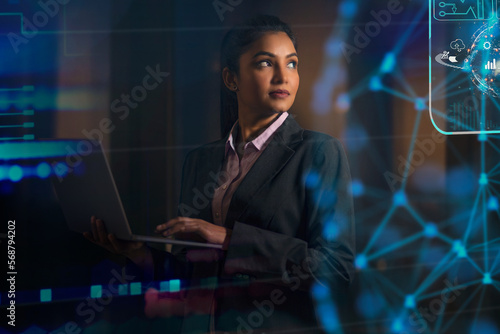 Digitally enhanced shot of a  technician/businesswoman working with virtual reality projection
