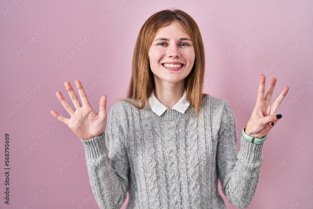 Beautiful woman standing over pink background showing and pointing up with fingers number eight while smiling confident and happy. Beautiful woman standing over pink background showing and pointing up with fingers number eight while smiling confident and happy.