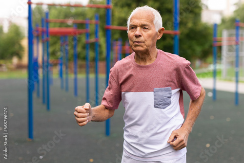 outdoors, an elderly man, doing sports © caftor