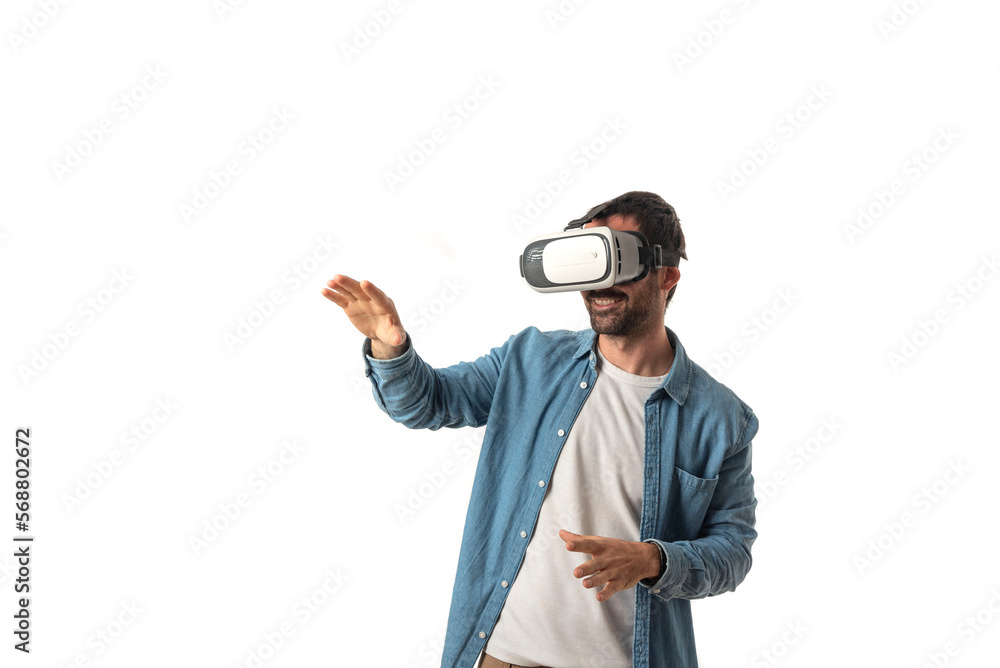 Attractive bearded man playing video games with virtual reality headset, trying to touch something with hand isolated on white background Attractive bearded man playing video games with virtual reality headset, trying to touch something with hand isolated on white background