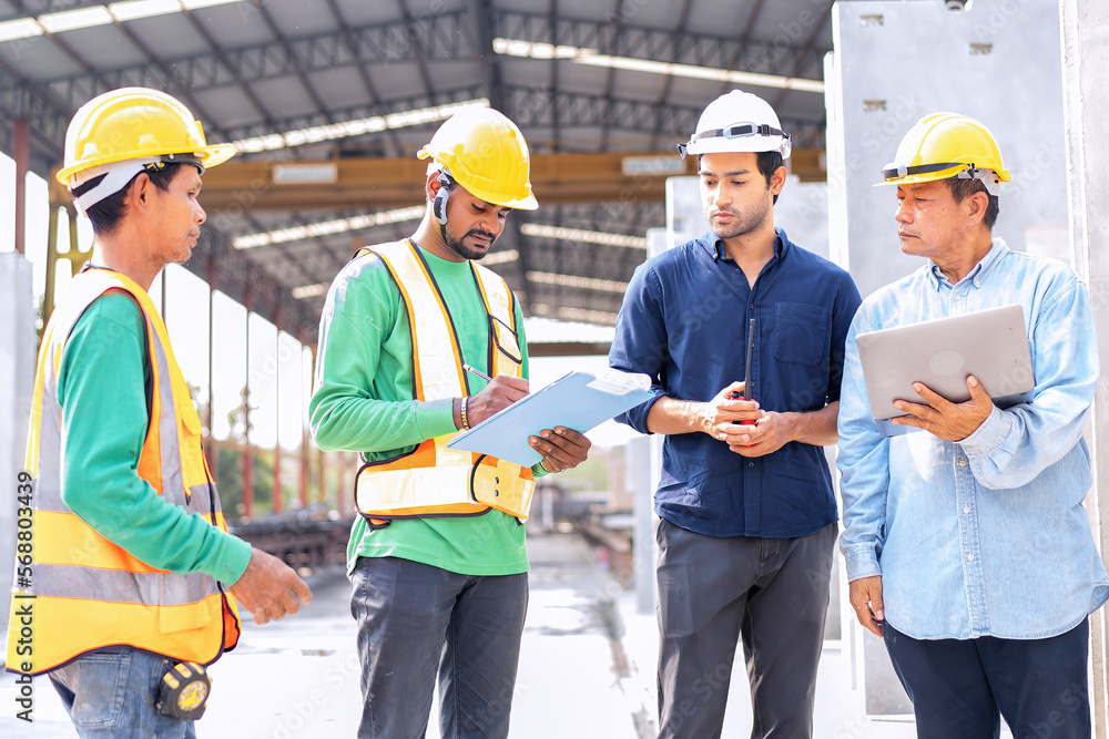 At building construction site engineer check quality precast concrete panel before installation At building construction site engineer check quality precast concrete panel before installation