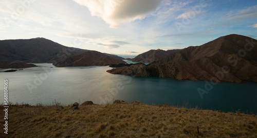 Panorama view of mountain lake nature landscape on Benmore Peninsula and Waitaki River in Canterbury New Zealand photo