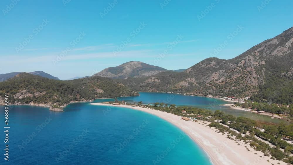 Aerial drone flying above Oludeniz beach and lagoon. Beautiful bay with crystal blue water Turkey. Aerial drone flying above Oludeniz beach and lagoon. Beautiful bay with crystal blue water Turkey.