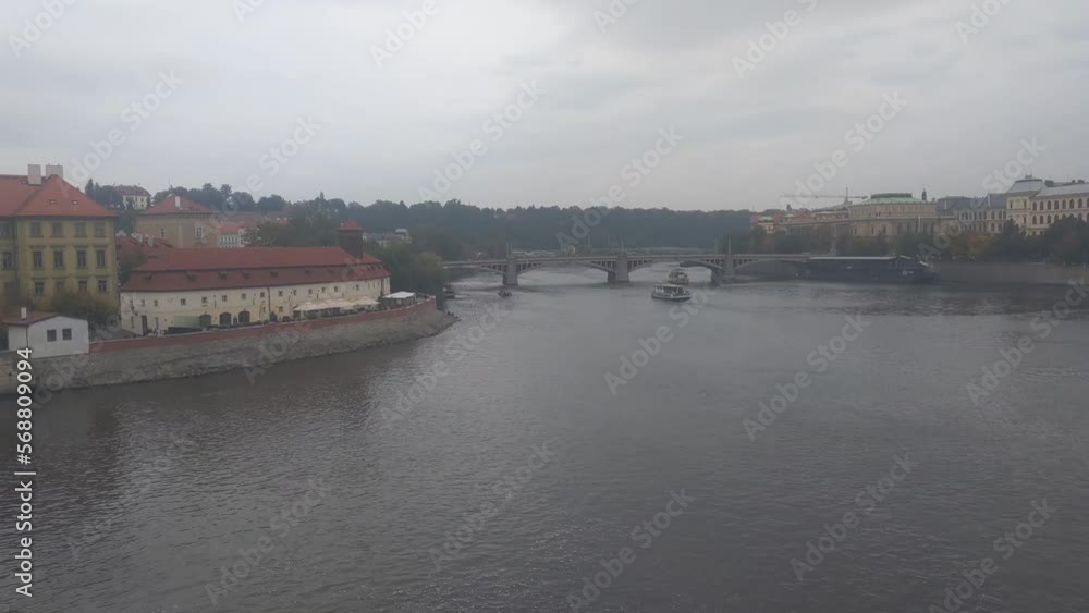 View of a cloudy autumn day in Prague and the river View of a cloudy autumn day in Prague and the river
