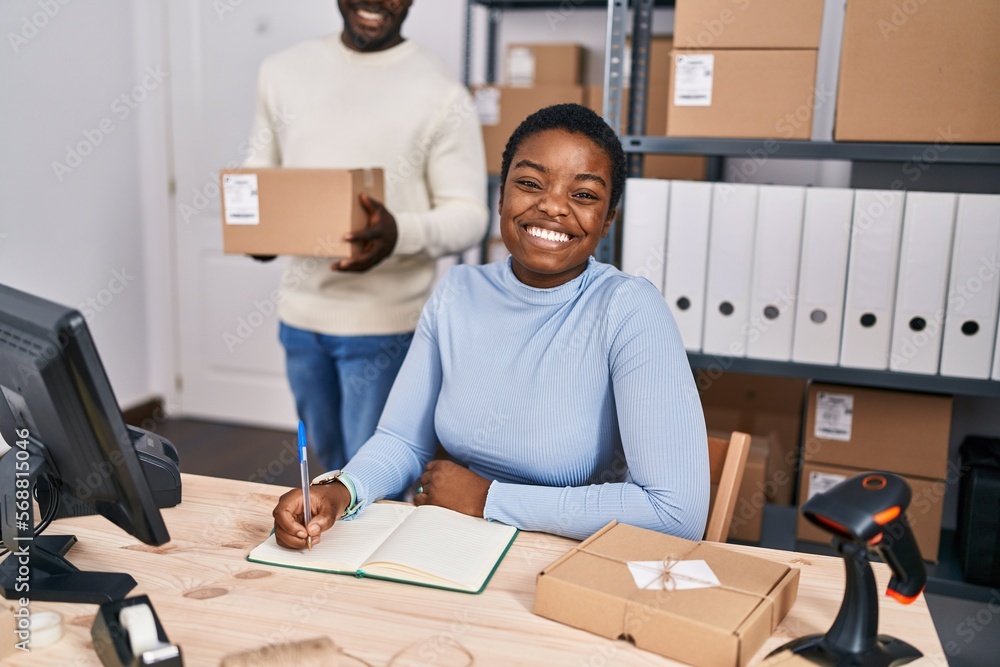© Krakenimages.com - Man and woman ecommerce business workers writing on notebook at office © Krakenimages.com - Man and woman ecommerce business workers writing on notebook at office