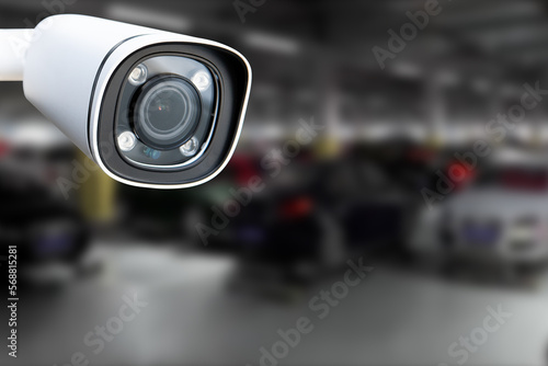 CCTV Camera Operating in car park building. Copy space.