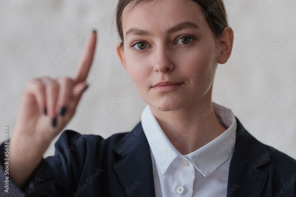 Portrait with copy space of charming, pretty, nice, stylish, brunette, trendy woman in shirt and black blazer, pointing forefinger on empty place