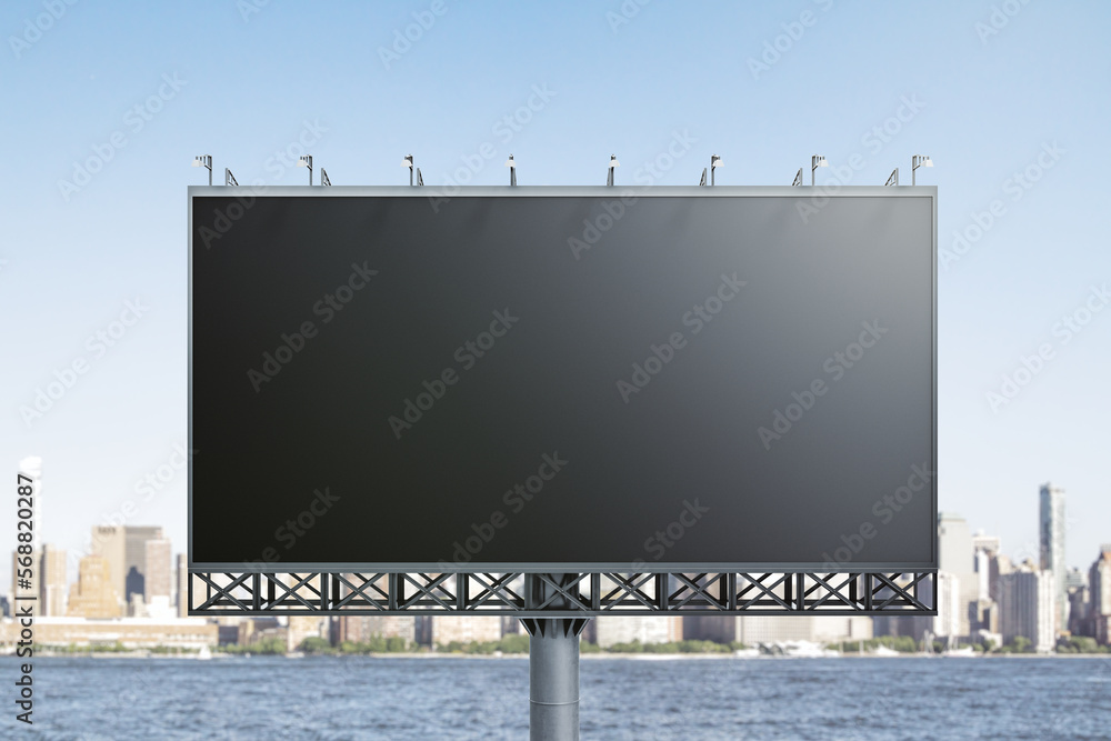 Blank black billboard on city buildings background, front view. Mockup, advertising concept Blank black billboard on city buildings background, front view. Mockup, advertising concept