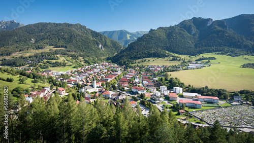Slovakian village Terchova with its graveyard in a valley between Fatra mountains. Hills and rock, blue sky.