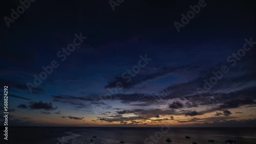 Timelapse of sunset scenery with moving clouds over the Caribbean sea photo
