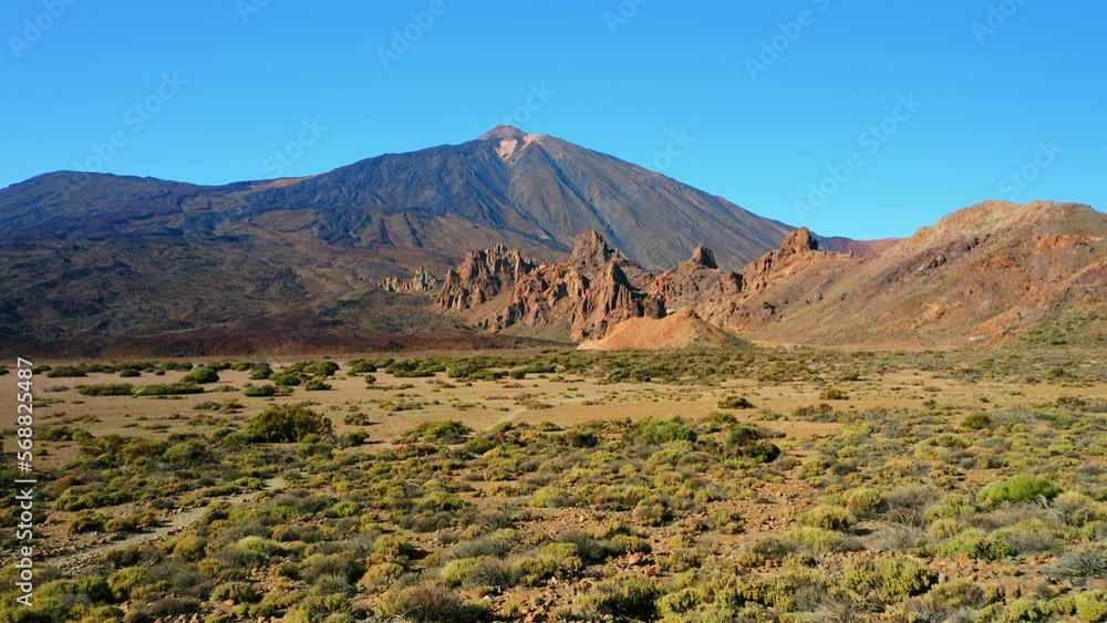 Volcanic mountain landscape in Teide National Park on Tenerife Canary Islands Spain. Rock formations, majestic environment against clear blue sky. Volcanic mountain landscape in Teide National Park on Tenerife Canary Islands Spain. Rock formations, majestic environment against clear blue sky.