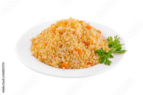 Boiled barley with carrots on plate