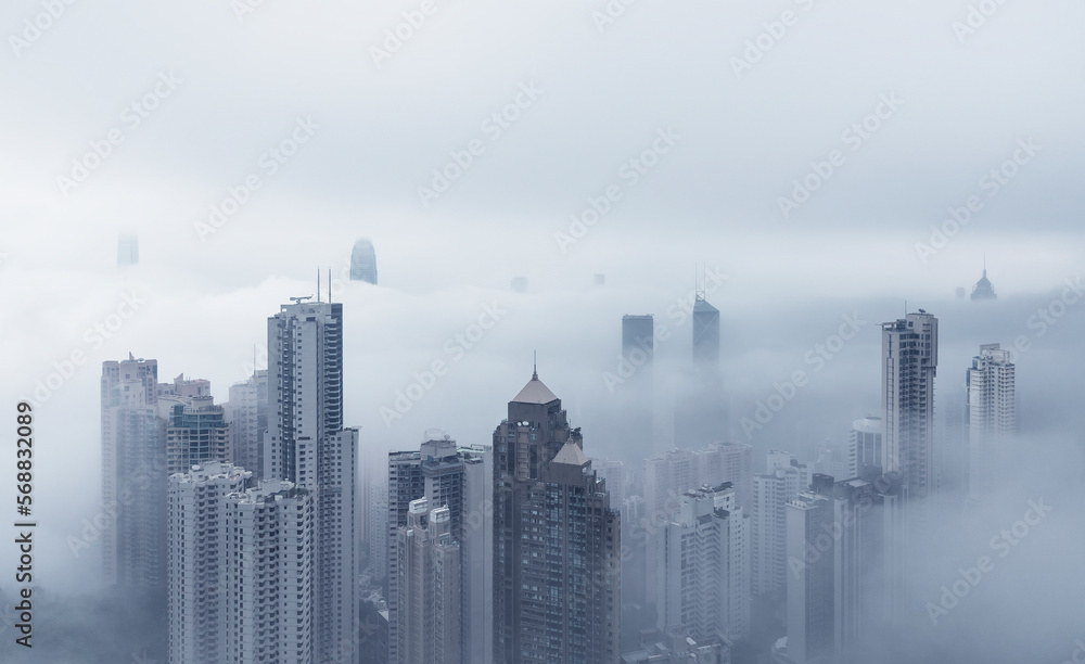 Skyscraper in downtown of Hong Kong city in fog Skyscraper in downtown of Hong Kong city in fog