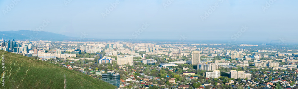 Panorama of the city of Almaty from a height. A beautiful city of Kazakhstan.