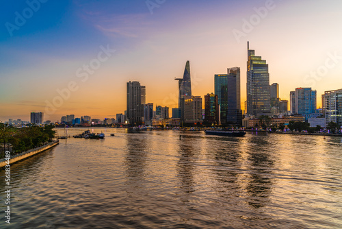 Ho Chi Minh City, Viet Nam 02 Jan 2023: Beautiful Sunset at district 1, view to Bitexco tower with Vietnam flag on the top building. One of the famous buildings in ho chi minh city © Quang Ho