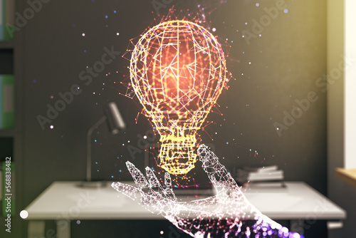 Double exposure of creative light bulb hologram and modern desktop with laptop on background, research and development concept © Pixels Hunter
