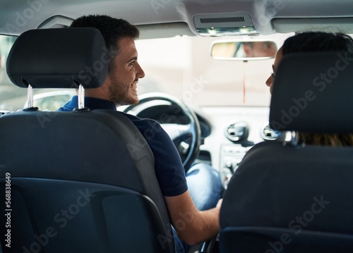 Young hispanic couple smiling confident driving car at street