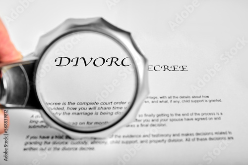 Fotografie divorce concept, magnifying glass accentuates the word divorce, a break up