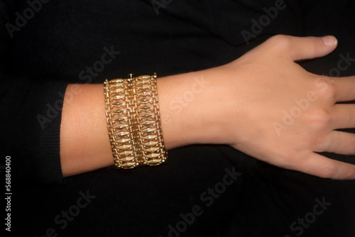 A lady's arm wearing a bracelet