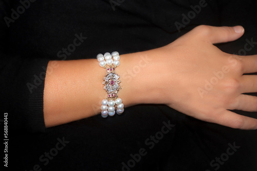 A lady's arm wearing a bracelet