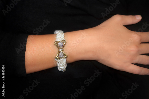 A lady's arm wearing a bracelet