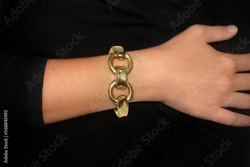 A lady's arm wearing a bracelet