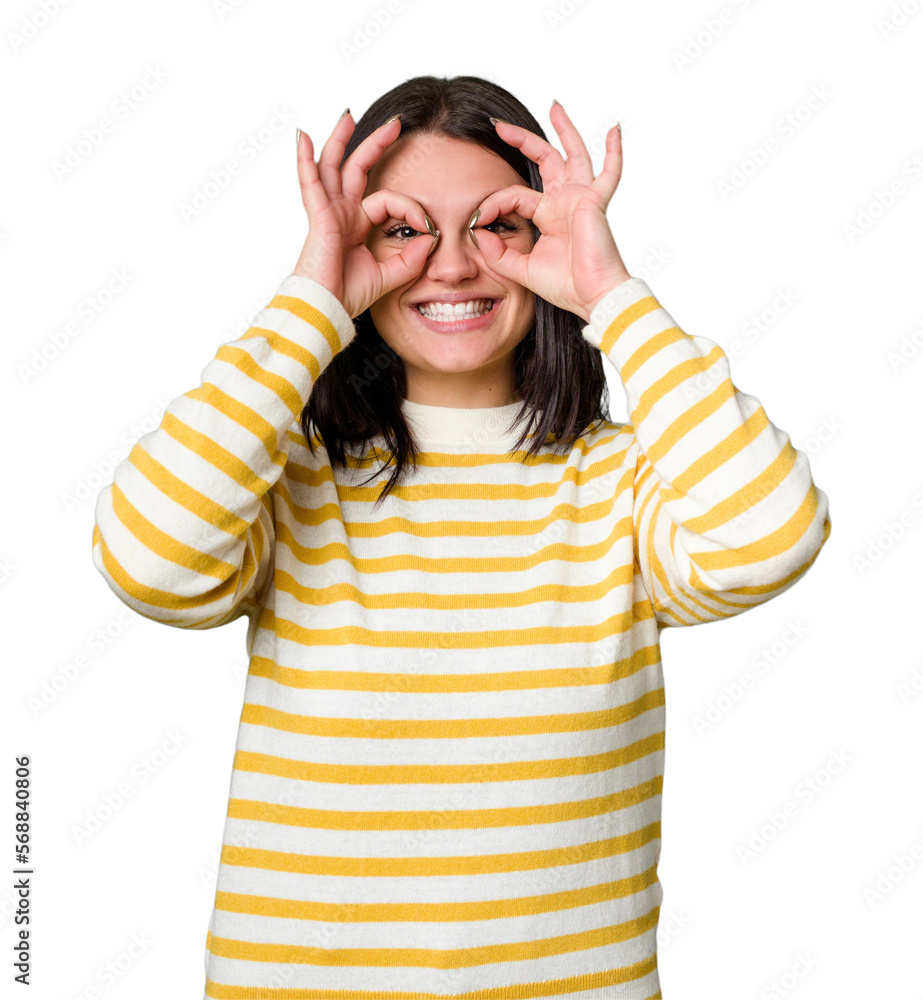 Young caucasian woman isolated showing okay sign over eyes Young caucasian woman isolated showing okay sign over eyes