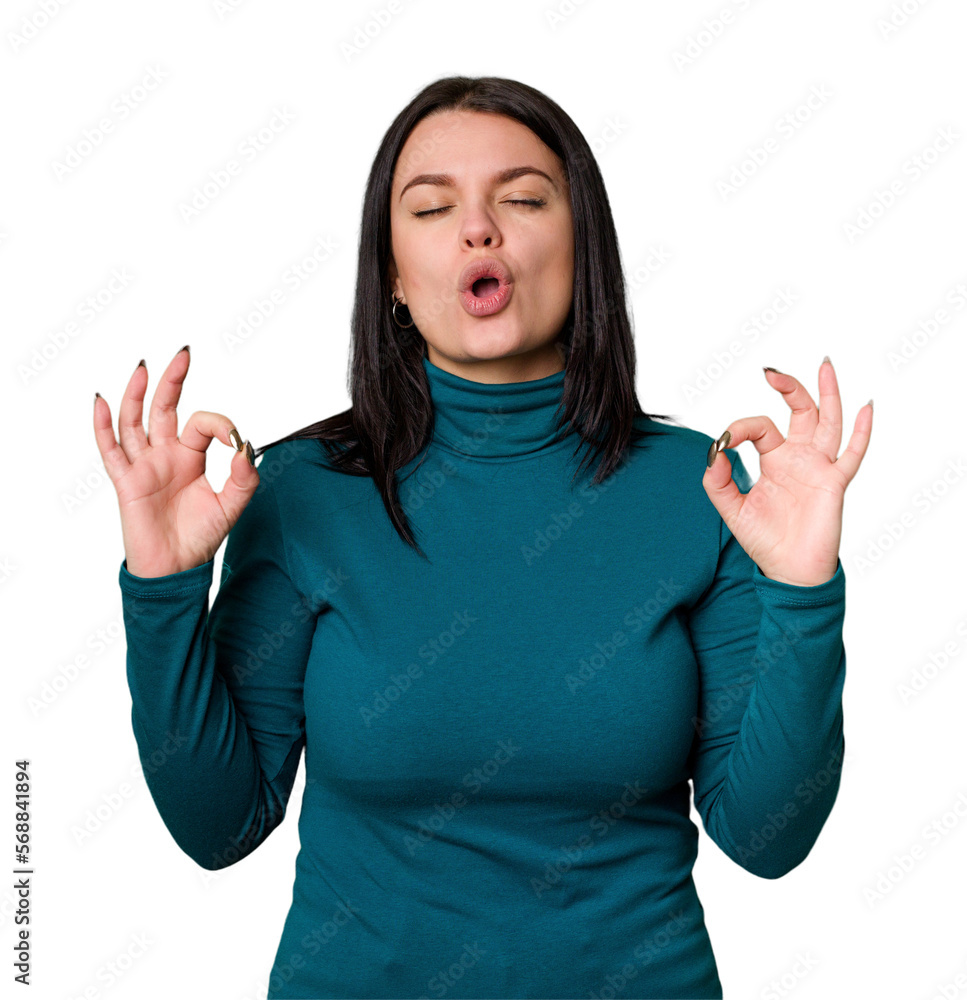 Young caucasian woman isolated relaxes after hard working day, she is performing yoga. Young caucasian woman isolated relaxes after hard working day, she is performing yoga.