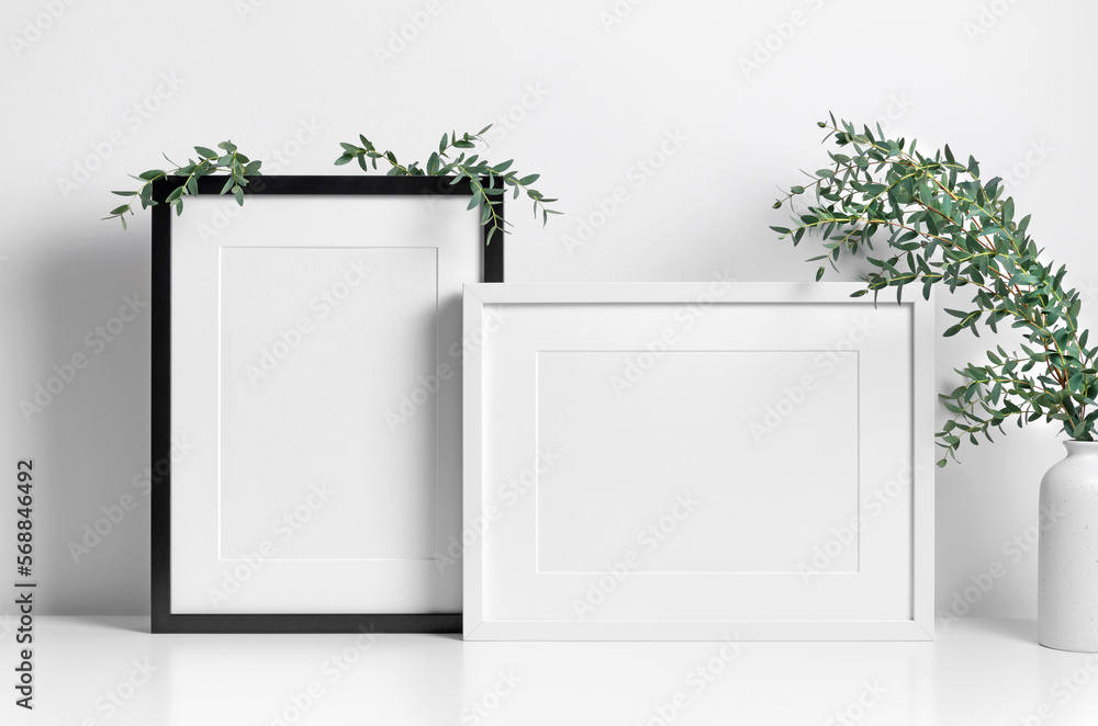 Picture frames mockup in white room with natural eucalyptus twigs, blank frame mockup with copy space - obrazy, fototapety, plakaty 