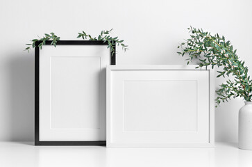 Picture frames mockup in white room with natural eucalyptus twigs, blank frame mockup with copy space