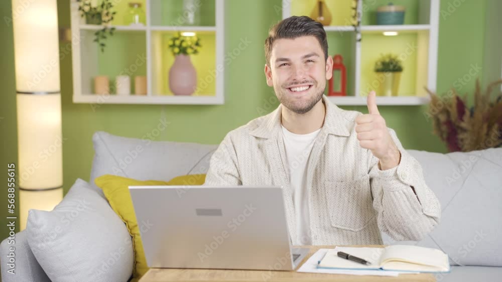 Man looking at laptop smiles at camera and makes positive gesture with his hand.
The young man quits his job and turns to the camera, smiling and making an 'OK' sign with his hands.
Man looking at laptop smiles at camera and makes positive gesture with his hand.
The young man quits his job and turns to the camera, smiling and making an 'OK' sign with his hands.