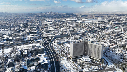 Aerial drone photo of Kifisias avenue and urban area of Marousi covered in snow, Athens, Attica, Greece photo