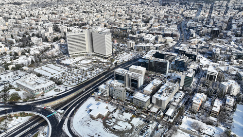 Aerial drone photo of Kifisias avenue and urban area of Marousi covered in snow, Athens, Attica, Greece photo