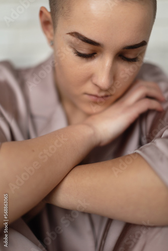 Portrait of unhappy pensive woman with cancer.
