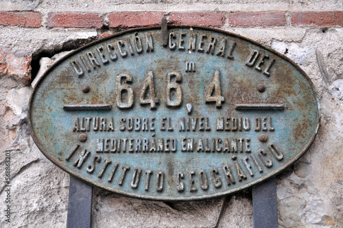 Altitude over sea level old cast iron sign of the Spanish Geographic Institute in Madrid (Spain)
