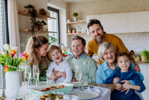 Canvas Print Portrait of happy multigenerational family during Easter dinner.