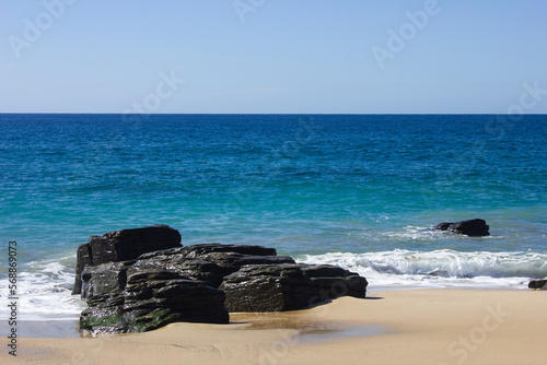 Rocks in a beach in front of the ocean