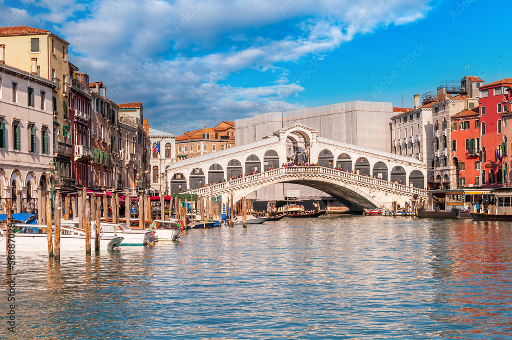 traffic on the Grand Canal near the Rialto Bridge in the background, in Venice, Veneto, Italy