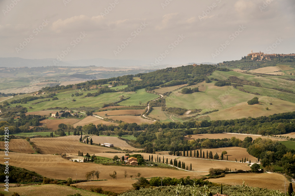 Naklejka premium Tuscany autumn landscape, rural roads and fields on sunset. Italy. 