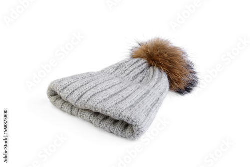 Gray winter hat with pompom isolated on white background.