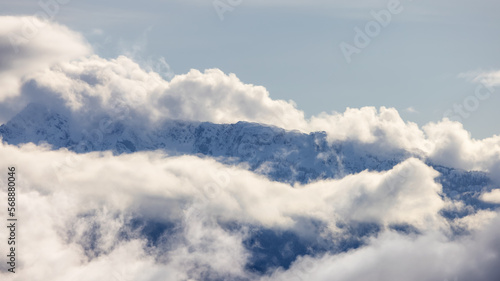 Tantalus Range covered in Snow and Clouds during Winter Season. Near Whistler and Squamish  British Columbia  Canada. Nature Background