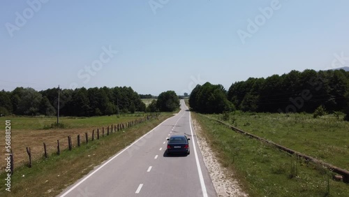 BLUE CAR DRIVES THROUGH THE FORESTS PERFECT ROUTE