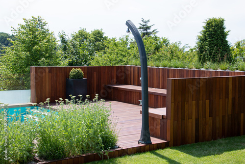 Wood timber decking, siding, fence and bench installation design in natural landscape overlook