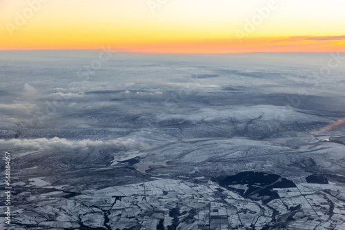 Aerial view of the Peak District, during sunset in winter with snow