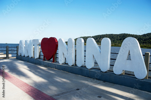 Sign made in concrete with the name of the city of Antonina photo