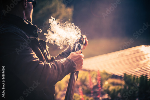 Male Hunter in a Smoke After a Shot