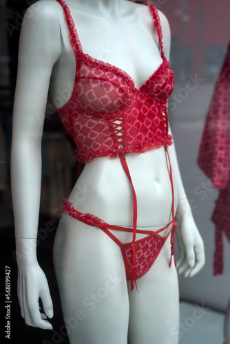 closeup of red underwear with little hearts on mannequin in a fashion store showroom