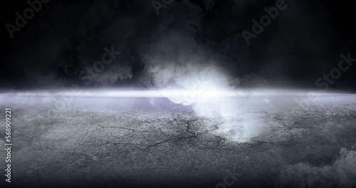 dark background with smoke and light on the horizon